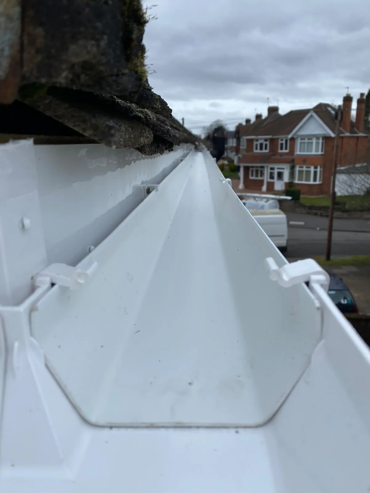 Inside of a new uPVC gutter with its brackets